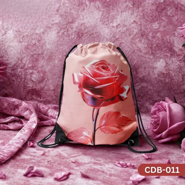 "Gentle Rose Drawstring Bag with Single Red Rose on Pink Background Print CDB-011", "Elegant Floral Sling Bag featuring a Beautiful Red Rose Bloom", "Durable Polyester Drawstring Bag with Romantic Rose Art CDB-011".