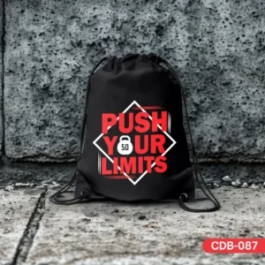 Black LIMITLESS SACK drawstring bag featuring a bold red and white 'PUSH YOUR LIMITS' design with a kettlebell icon, displayed on a concrete surface