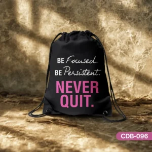The Relentless Spirit black drawstring bag featuring the motivational quote 'BE Focused. BE Persistent. NEVER QUIT.' in elegant white and bold pink lettering, displayed on a textured, earthy background