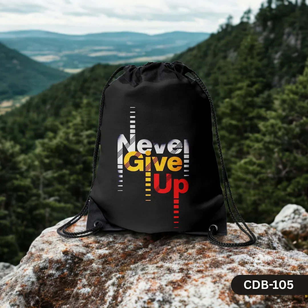 "Peak Persistence black drawstring bag with 'Never Give Up' in colorful text, displayed on a rock with a mountain landscape background."