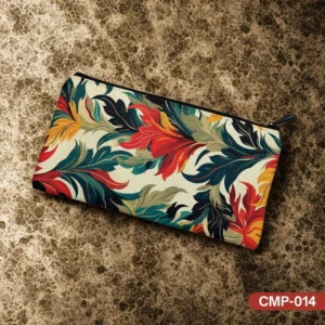 "Manor Garden Makeup Pouch (CMP-014) with elegant botanical leaf print in red, gold, and teal on a cream background, displayed on a textured surface."