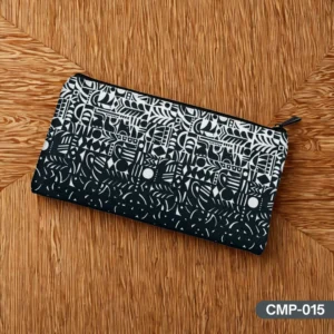 The Monolith Makeup Pouch (CMP-015) featuring its bold black and white abstract graphic print with a fade effect, on a wooden background."