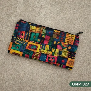 VividWeave makeup pouch (CMP-027) displaying a colorful abstract geometric pattern with vibrant jewel tones, lying flat on a textured beige surface