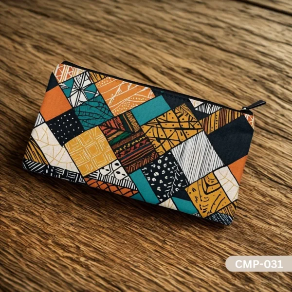 Stitched Stories Makeup Pouch with an earthy-toned, tribal patchwork design, resting on a rustic wood table.