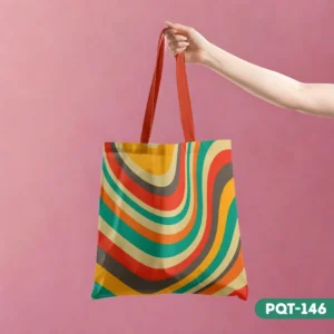 Rhythmic Lines Tote Bag (PQT-146) with a retro 70s-style colorful swirl pattern, held by a hand against a pink background